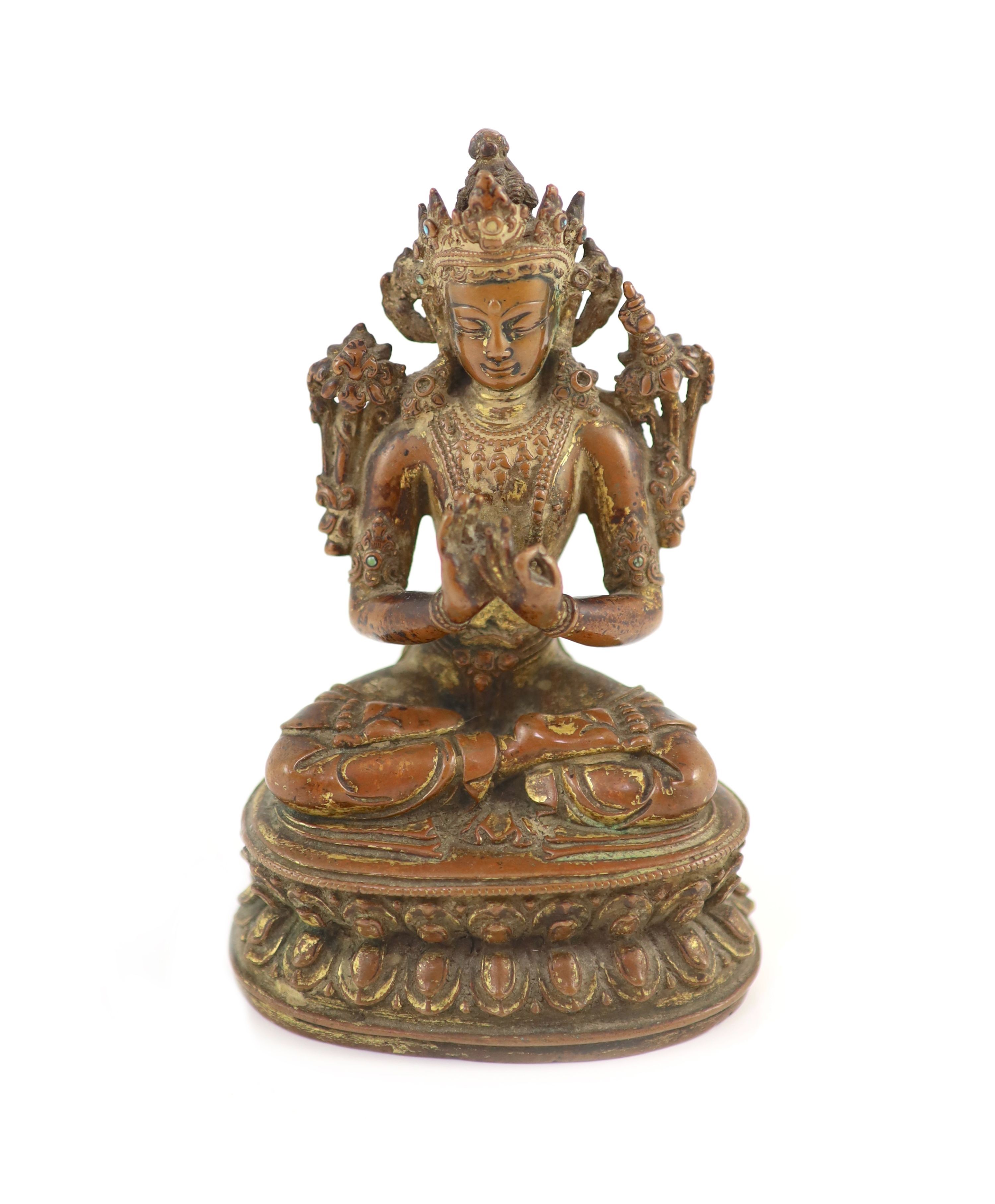 A Tibetan gilt copper alloy figure of Maitreya, 17th/18th century, 14.8cm high, worn